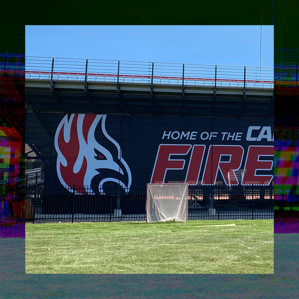 Sports team sign on the back of bleachers