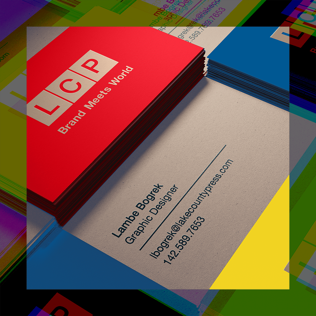 Close up of multiple stacks of business cards, one with the LCP logo and slogan "Brand Meets World".