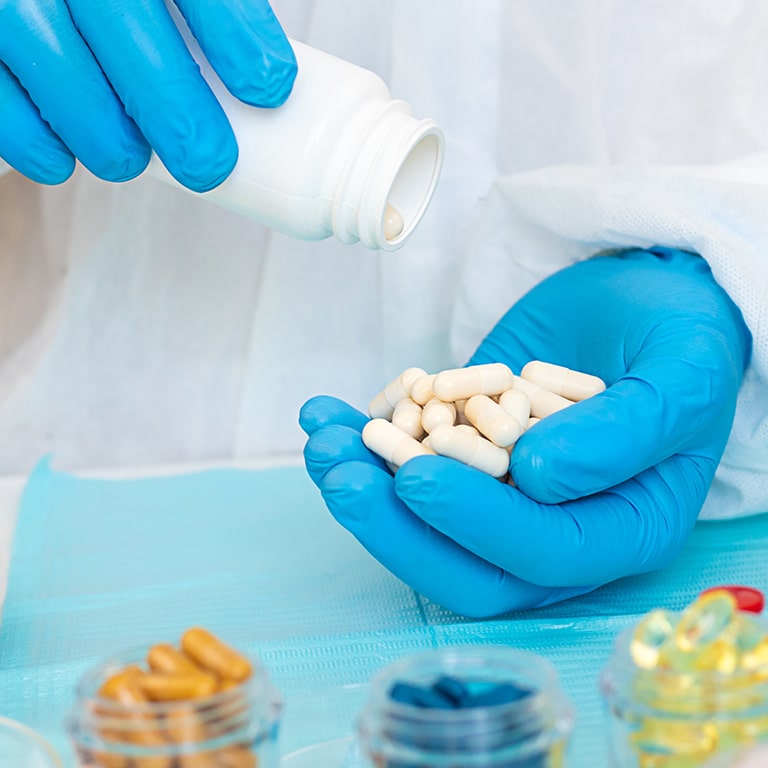 examine drugs in the laboratory. Selective focus. pills.