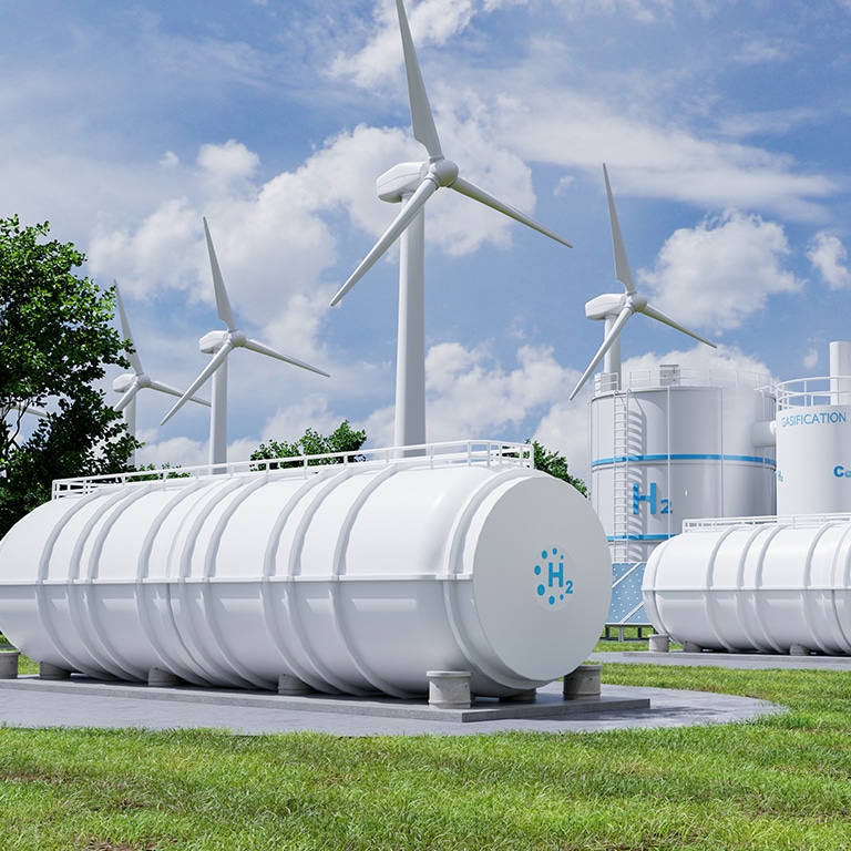 Hydrogen H2 storage tanks in renewable energy plant with wind turbines and solar panels. Clean energy production and sustainable power generation concept- 3D rendering