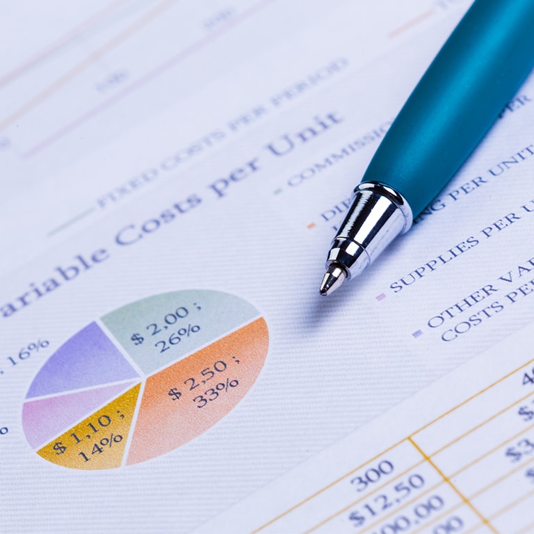 Business performance graph with ballpoint pen