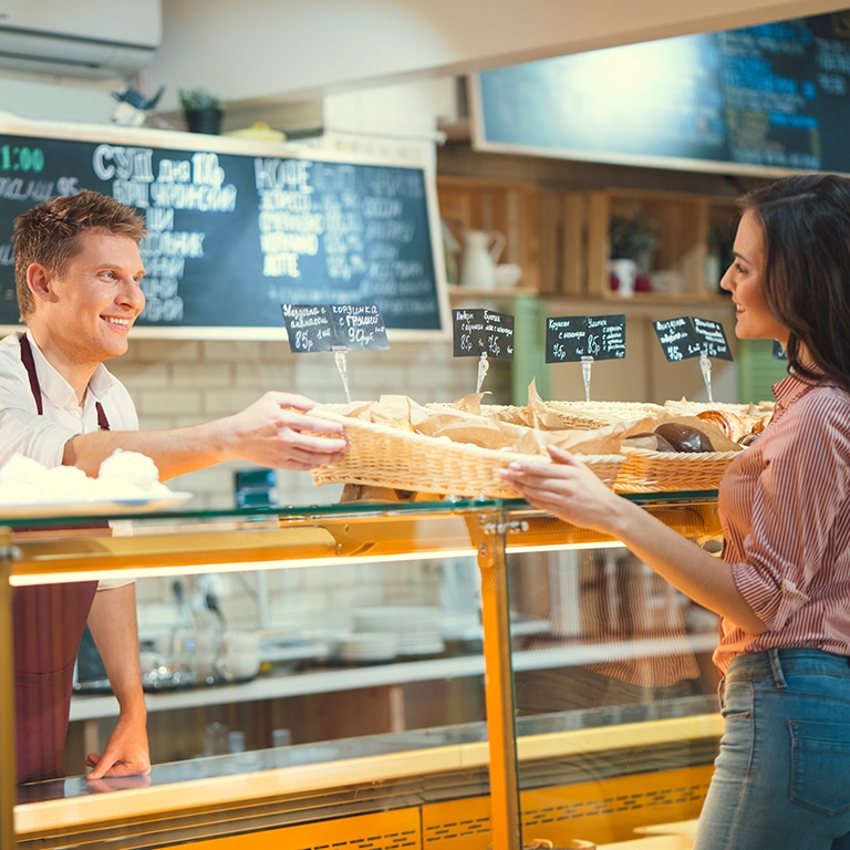 Smiling woman in bakery