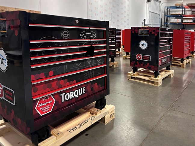 Snap-on toolbox decorated with "Snap On Mechanical & Electrical Torque, nc3, Certified Training".